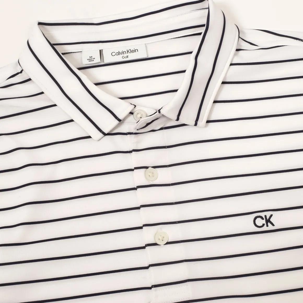 calvin_klein_mens_fine_st_2.webp Calvin Klein Men's Fine Stripe Golf Polo Shirt