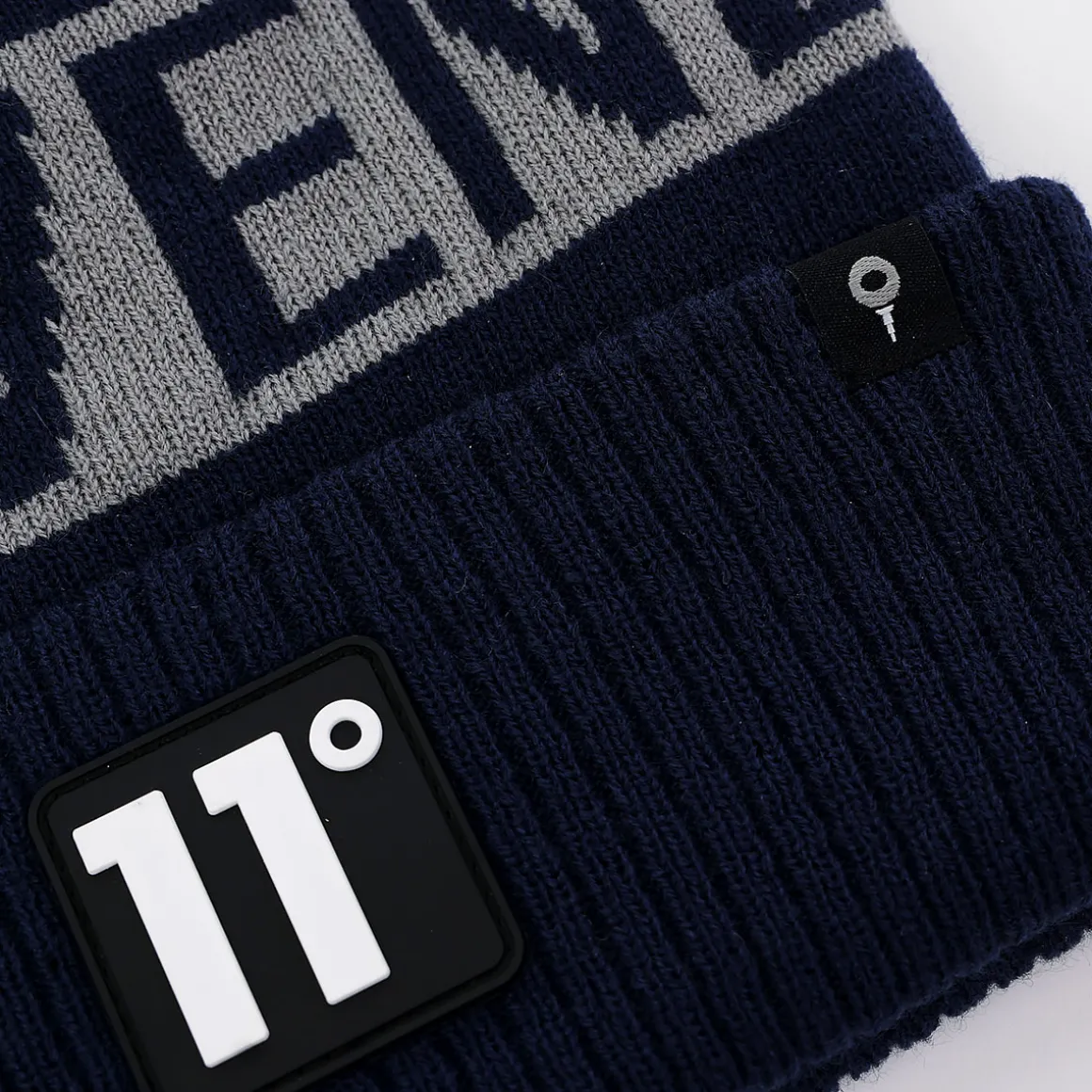 degrees_fleece_lined_gra_5-1.webp 11 Degrees Fleece Lined Graphic POM Golf Beanie